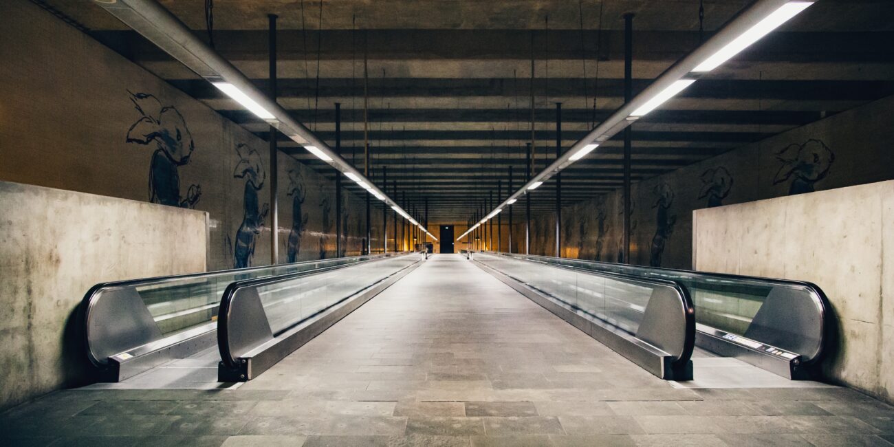 A wide shot of moving walkways or autowalks